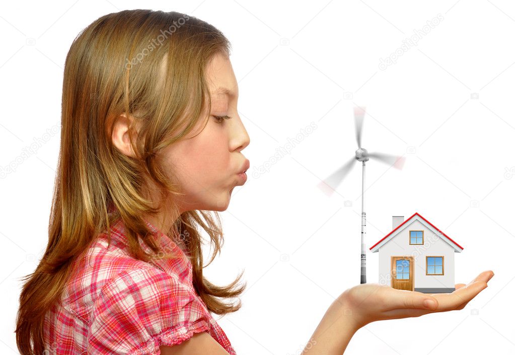 Girl blowing on the wind turbines