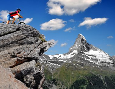 Cyclist in the Swiss Alps clipart