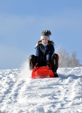 Girl on a sleigh clipart