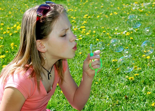Girl with a bubble blower — Stock Photo, Image