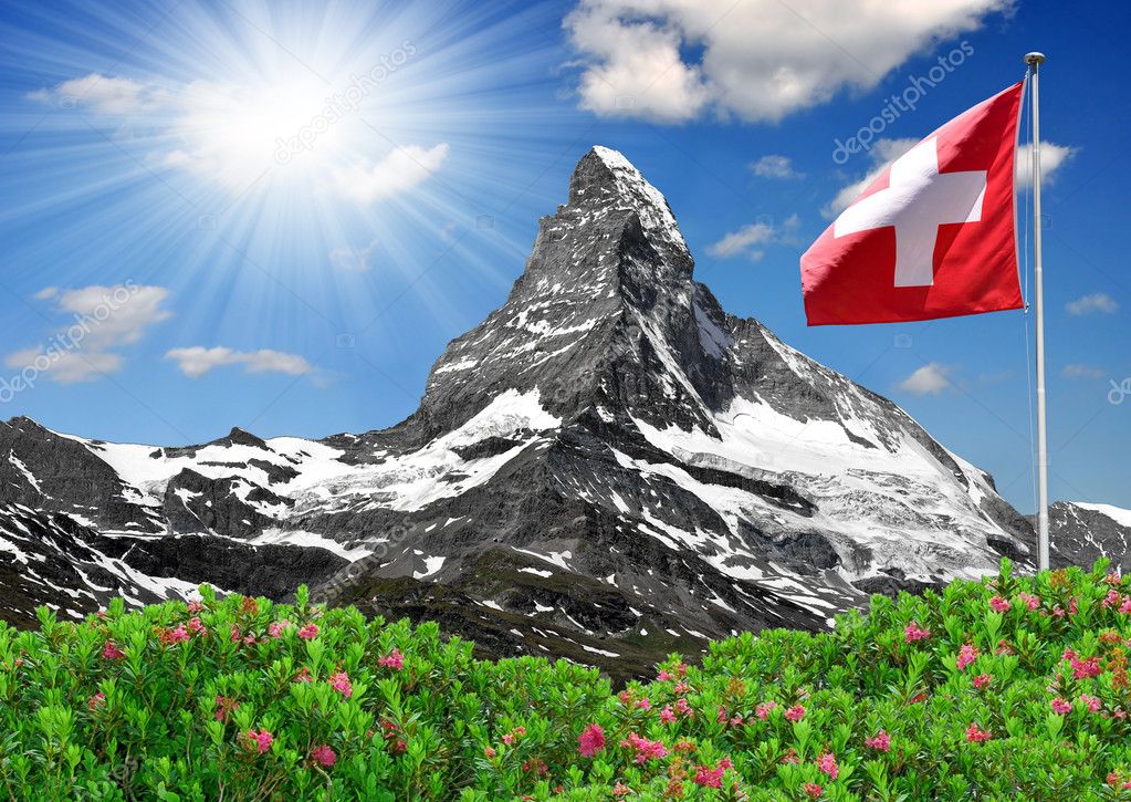 Schönes Matterhorn mit Schweizer Flagge - Stockfotografie ...