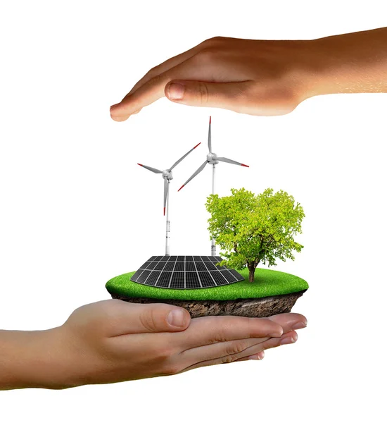 Little island with solar panel and wind turbines in the hands — Stock Photo, Image