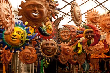 A lot of beautiful handmade masks of sun clipart