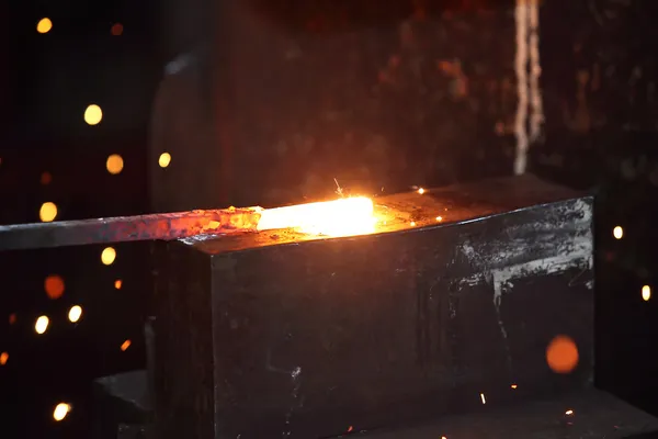Preparing some figure from hot steel stick — Stock Photo, Image