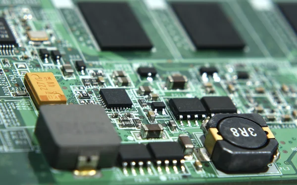 Green laptop motherboard in macro — Stock Photo, Image