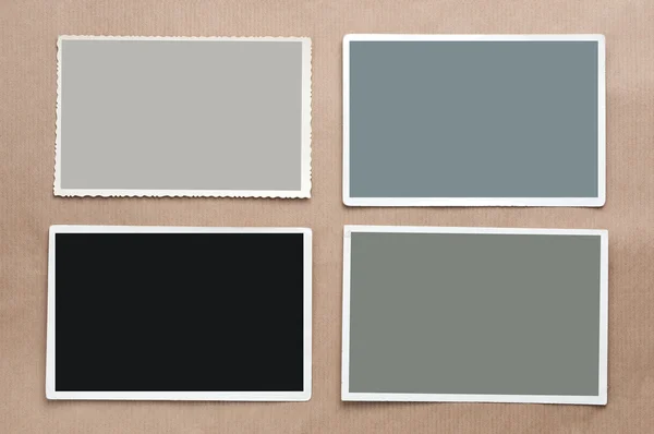 Set de cuatro fotos antiguas en blanco sobre fondo de cartón gris —  Fotos de Stock