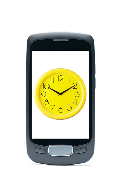 Teléfono móvil clásico con un reloj sobre fondo blanco - origi —  Fotos de Stock