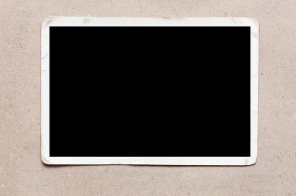 Velho, imagem em branco no fundo de papelão cinza — Fotografia de Stock