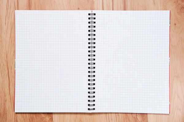 Skrivbok på table.exercise bok om trä bakgrund — Stockfoto