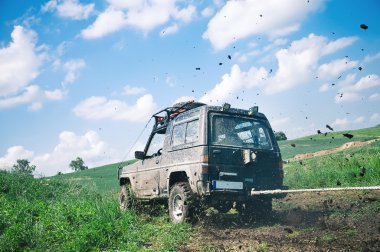 Offroad through muddy field clipart