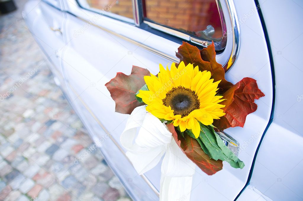 Wedding car with yellow flower