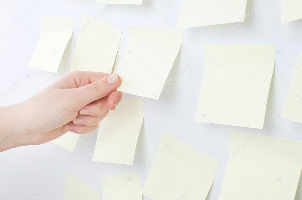Women Hand holding sticky note on white background