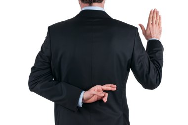 Young businessman in suit telling a lie with the fingers crossed clipart