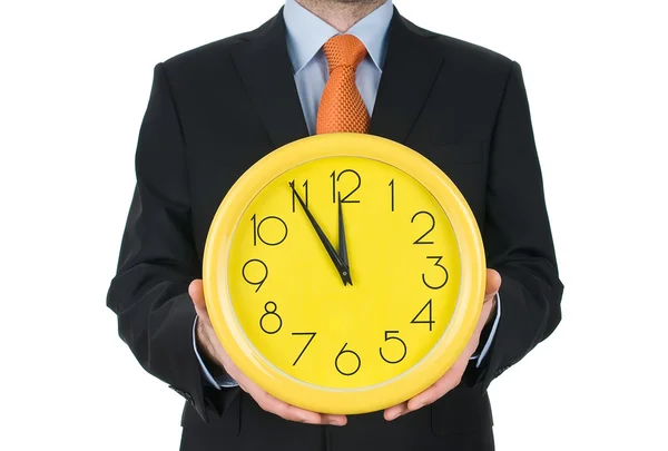 Businessman hand holding the clock isolated on white background — Stock Photo, Image