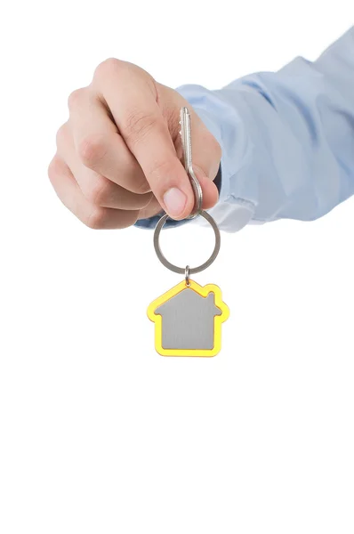 Ruka drží klíč od domu — Stock fotografie