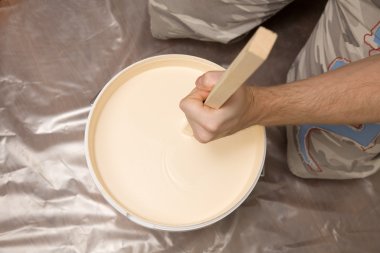 Picture of a hand mixing paint clipart