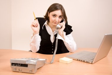 Young secretary with telephone and pencil clipart