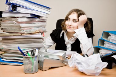 Young businesswoman with tons of documents clipart