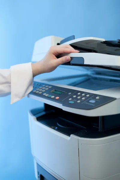 Woman's hand with copier — Stock Photo, Image