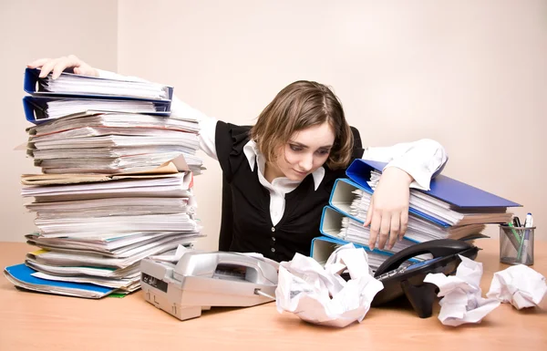 Young businesswoman with tons of documents — Stock Photo, Image