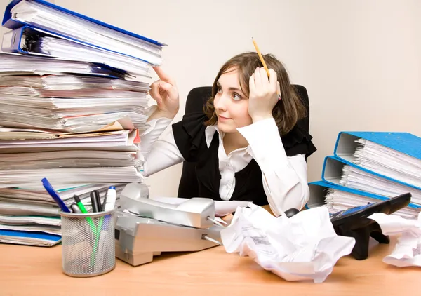 Young secretary with a lot of folders — Stock Photo, Image