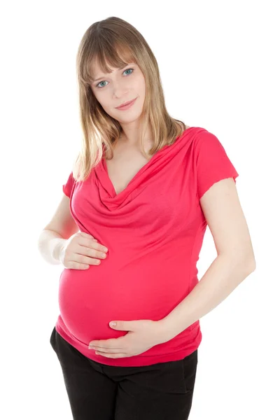 Schöne schwangere Frau schaut in die Kamera — Stockfoto