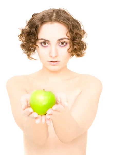 Girl holding an apple (focus on girl) — Stock Photo, Image