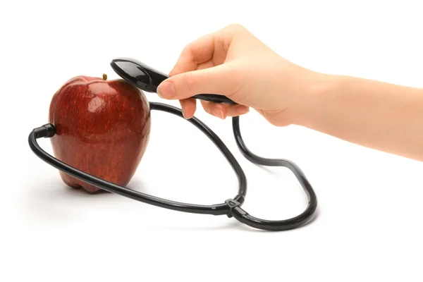 A red apple and a stethoscope — Stock Photo, Image
