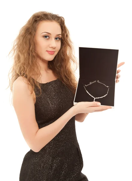 Beautiful woman holding a box with jewel — Stok fotoğraf