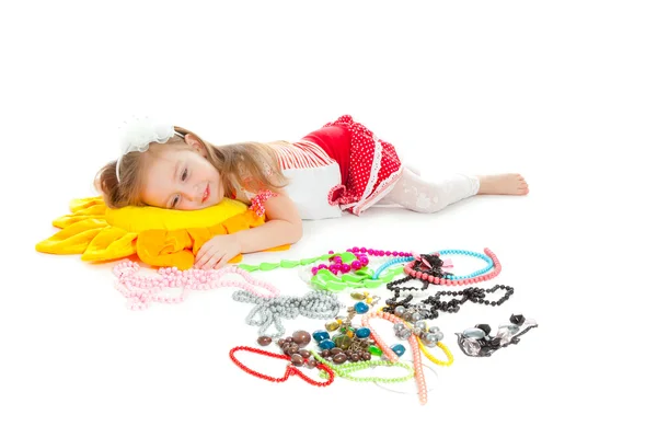 Little girl with toy and jewel isolated on white — Stock Photo, Image