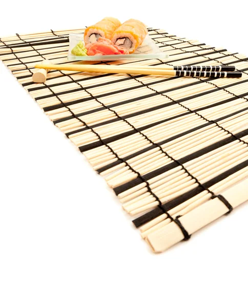 stock image Maki sushi with wasabi on bamboo sushi mat isolated