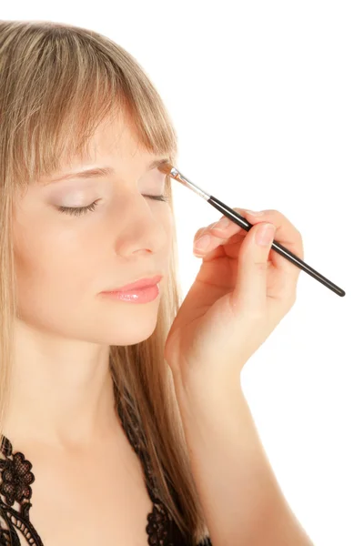 Mulher aplicando maquiagem no rosto do intérprete — Fotografia de Stock