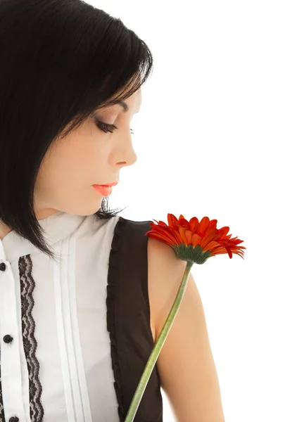 Woman looking on the red flower — Stock Photo, Image