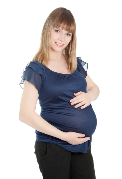 Красивая беременная женщина смотрит в камеру — стоковое фото