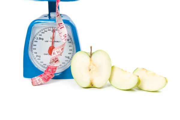 Picture of scale with apple and measure tape — Stock Photo, Image