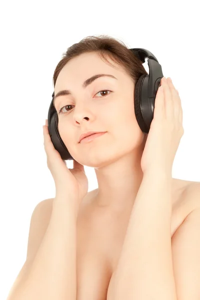 Müzik dinlemek için güzel bir çıplak kadın — Stok fotoğraf