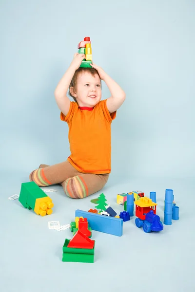 Menino com brinquedos — Fotografia de Stock