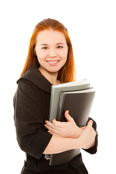Kobieta uśmiechając się i trzyma dwa foldery na białym tle — Zdjęcie stockowe