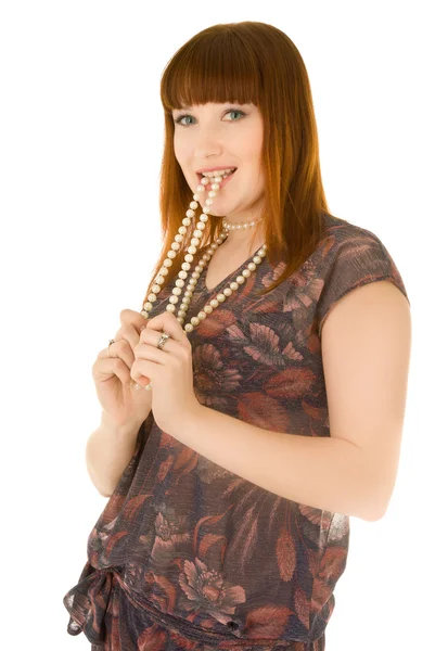 Red haired woman with beads in her mouth — Stock Photo, Image