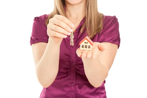 Woman's hands holding house and keys — Stock Photo, Image