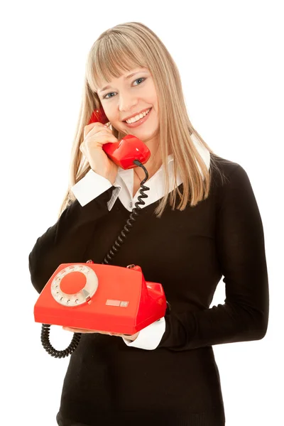 Mujer sonriente con teléfono viejo — Foto de Stock