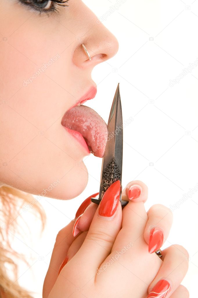 Woman's tongue with knife