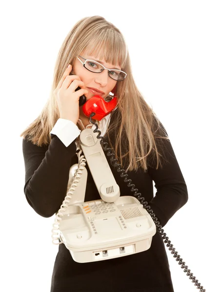 Businesswoman with telephones — Stock Photo, Image