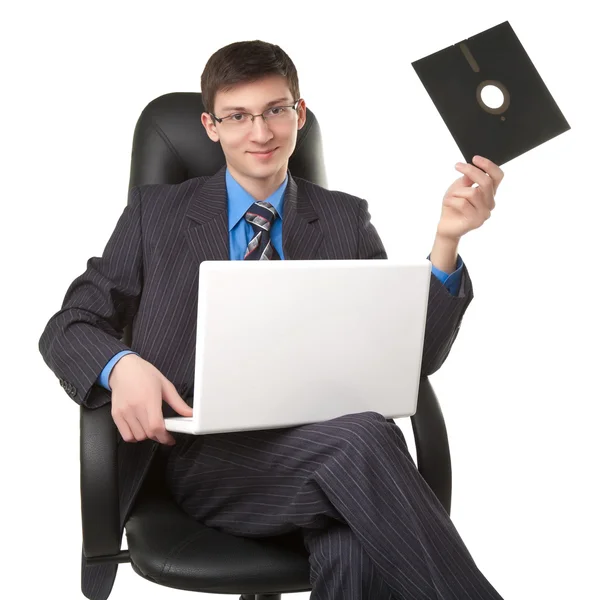 Young man with floppy disk — Stock Photo, Image