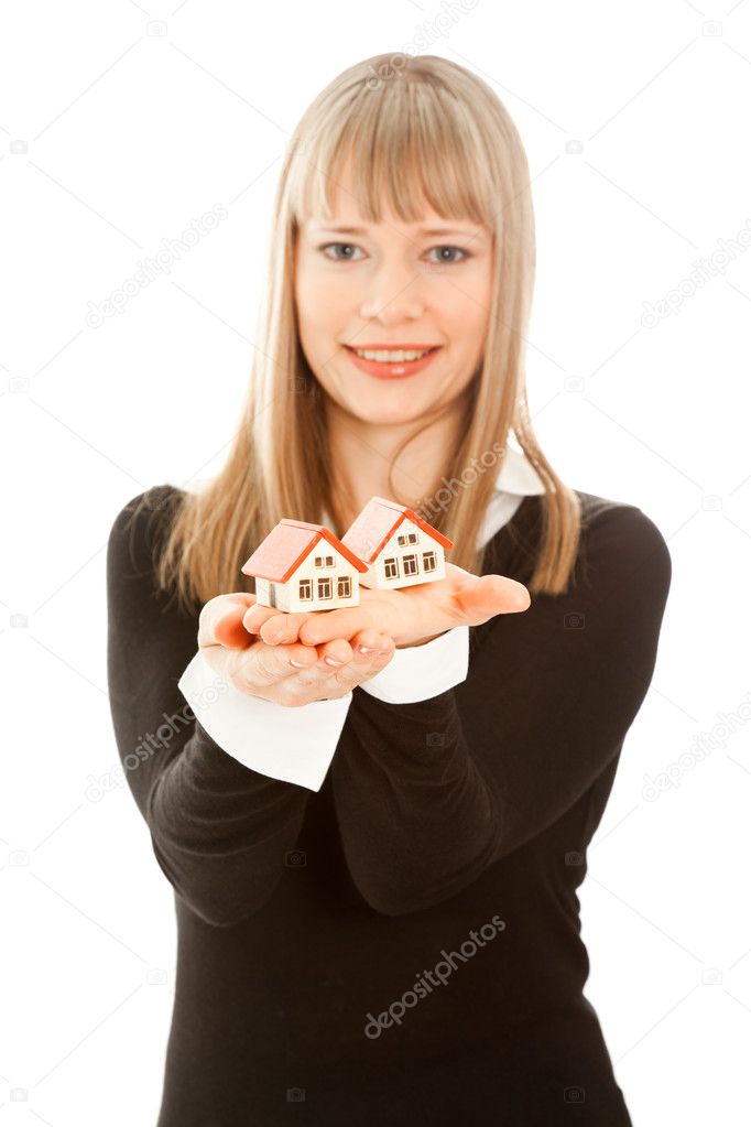 Picture of woman holding two house (focus on house)