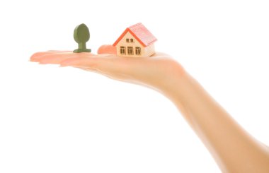 Woman hand with a little house clipart