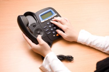 Woman's hands with telephone clipart