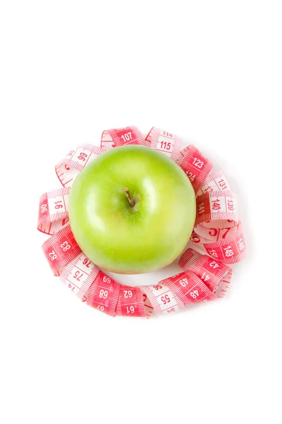 Foto van groene appel en maatregel tape — Stockfoto