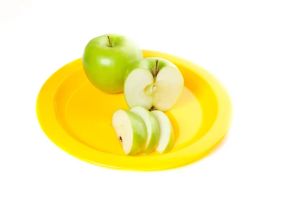 A yellow plate with apples — Stock Photo, Image