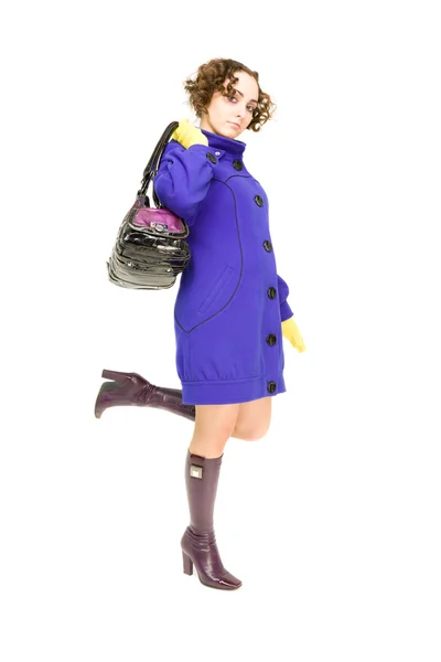 Schönes Mädchen mit Handtasche stehend — Stockfoto